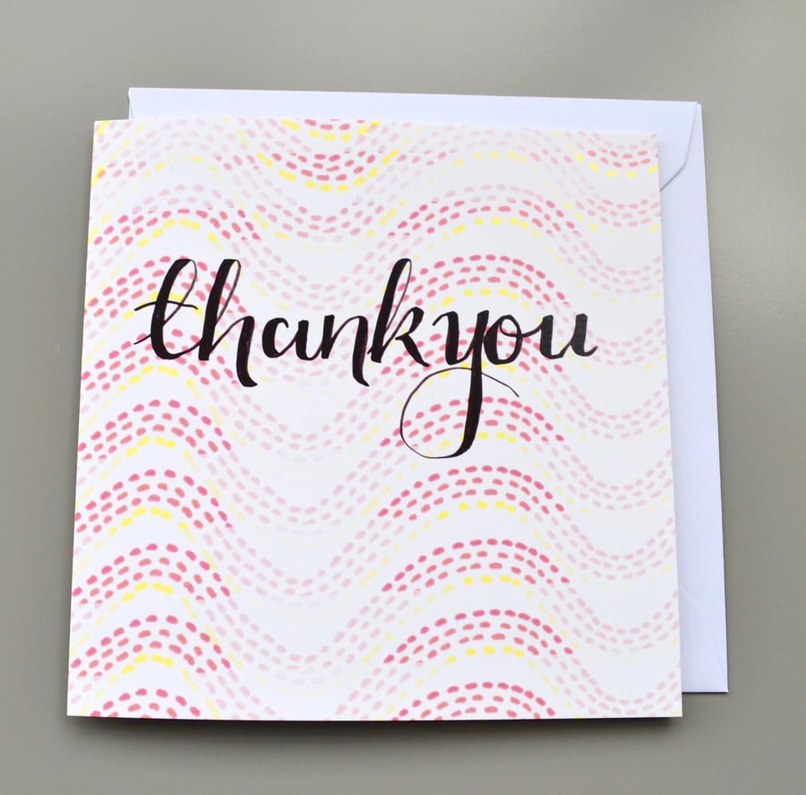 Hand Lettered Thank You Card on Orange Toned Patterned Background