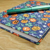 A5 Notebook with glow-in-the-dark pumpkin fabric cover