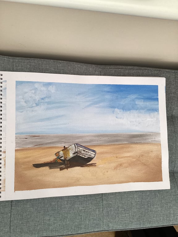 Rustic boat on lonely shore.