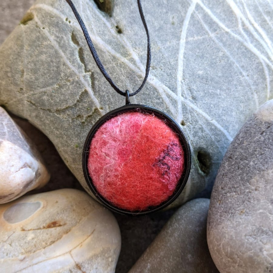 Felted pendant - red and pinks