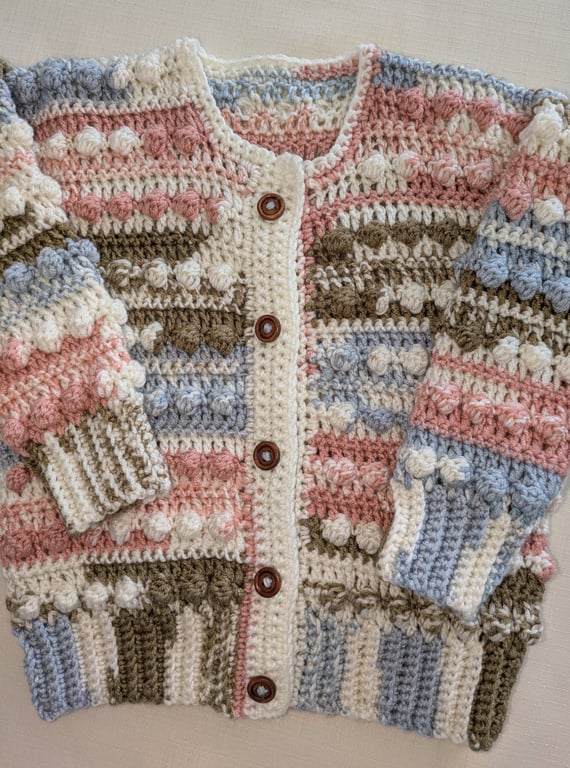 Random neutral coloured cardigan anti pil yarn for an 18 month old little one 