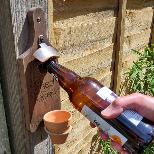 Wall mounted bottle opener with flowerpot cap catcher (shed faced)