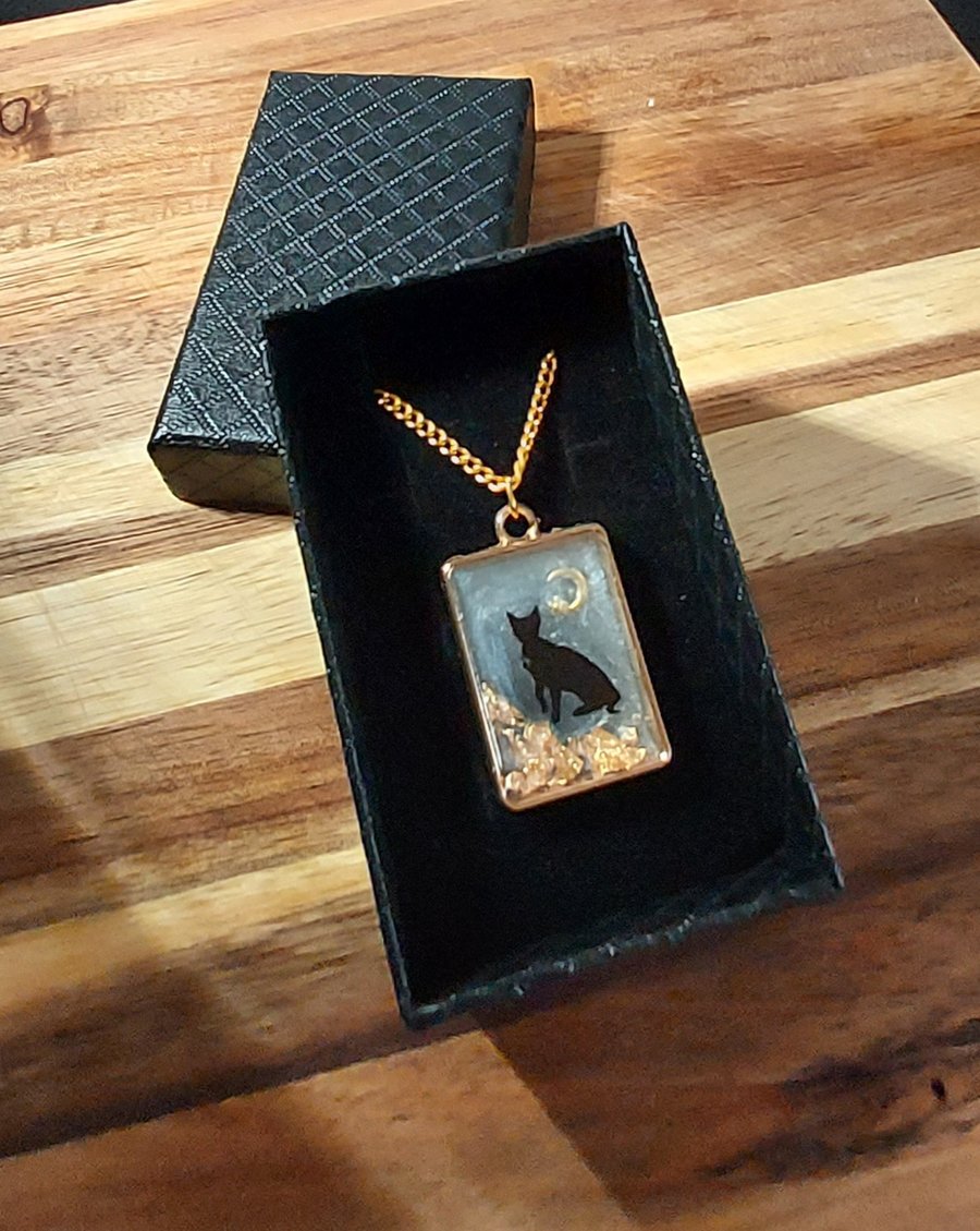  Resin pendant necklace featuring a black cat