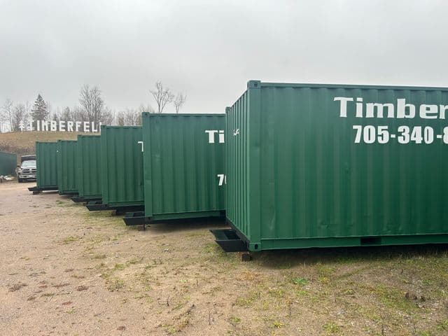 Green Timberfell storage containers in the yard
