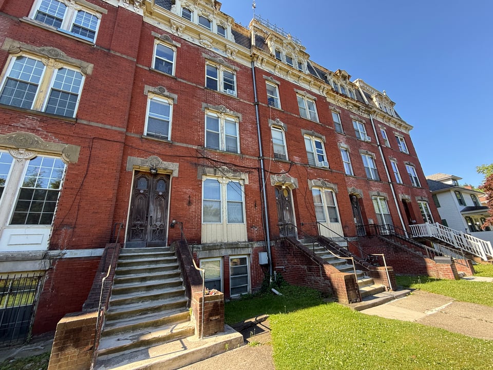 Street-front view of 7 Eastman Terrace and adjoining buildings in Poughkeepsie, New York