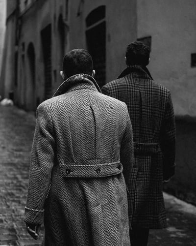 Monochrome Urban Walk in Patterned Overcoats