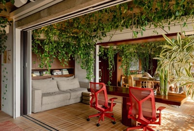 Biophilic Modern Home Office with Red Ergonomic Chairs