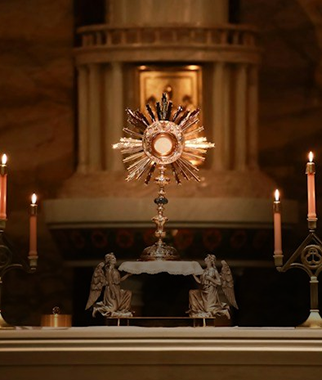 Monstrance on the altar between candles