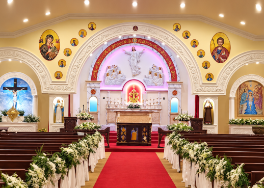 Stained glass and pews inside a Catholic church