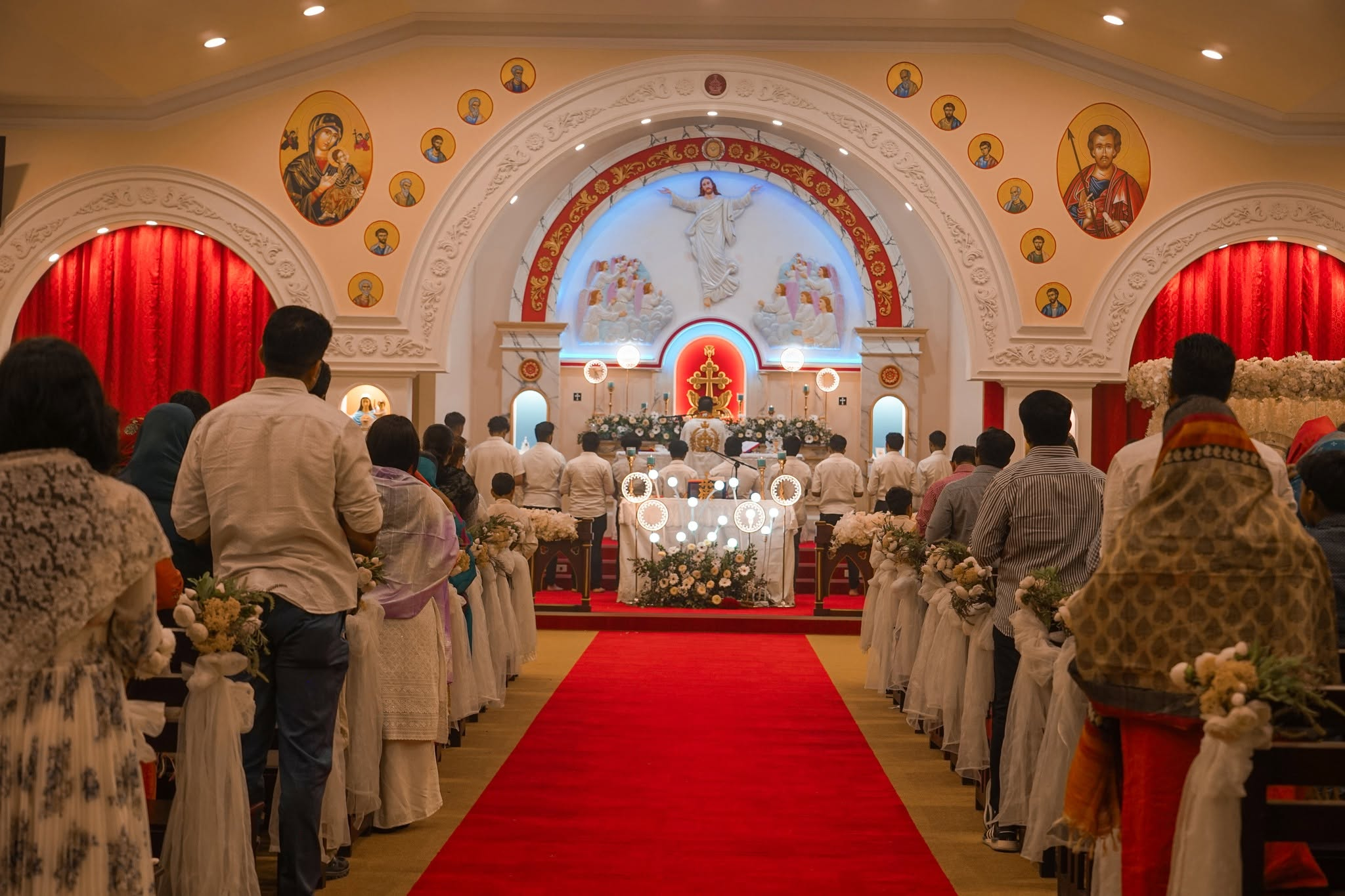 A congregation gathered in a candlelit church