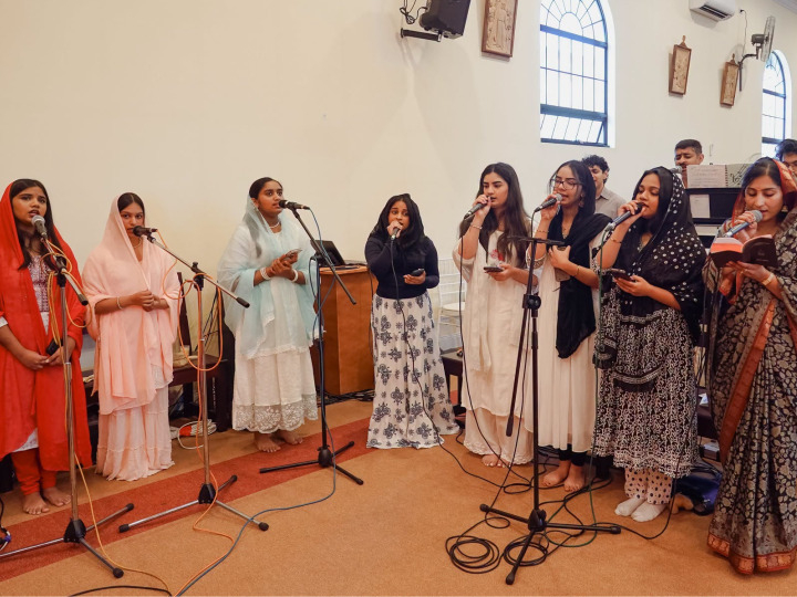 Choir members singing together in church