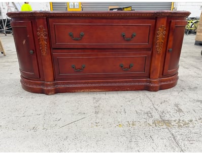 Elegant mahogany serpentine sideboard featuring cl...