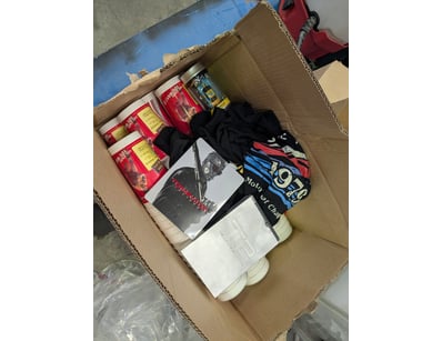 Mixed lot containing die-cast vehicles, apparel, a...