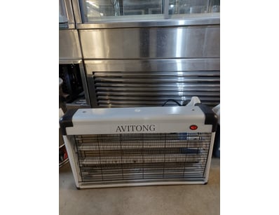 Avitong insect zapper featuring a white and black ...