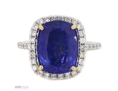 14K WHITE GOLD, TANZANITE AND DIAMOND, HALO RING. ...