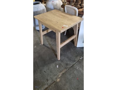 Solid timber side table featuring a natural light ...