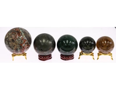 FIVE POLISHED CHRYSTAL SPHERES WITH STANDS

Sard...