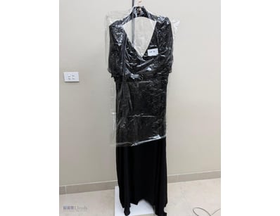 BLACK PLEATED EVENING GOWN WITH SHEER CAPE OVERLAY...