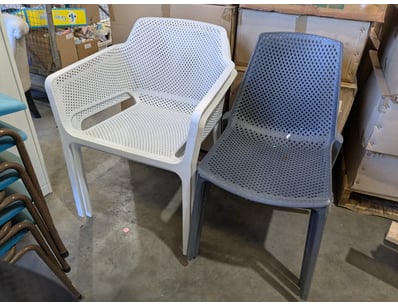 Modern stackable dining chairs featuring perforate...