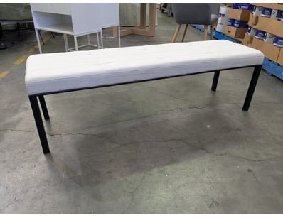 Modern upholstered bench featuring a white fabric ...