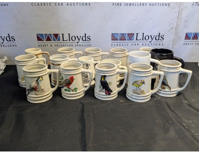 COLLECTION OF CERAMIC STEINS WITH WILDLIFE DECORAT...