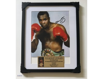 SUGAR RAY LEONARD SIGNED & FRAMED PHOTO 

A Black ...