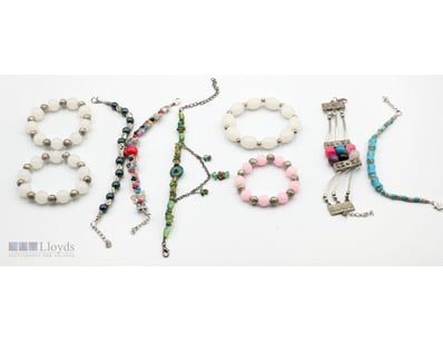 COLLECTION OF SILVER-TONED BEADED BRACELETS AND CH...