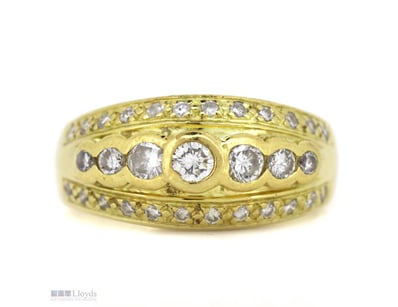 18K YELLOW GOLD AND DIAMOND, DRESS RING.      

Th...