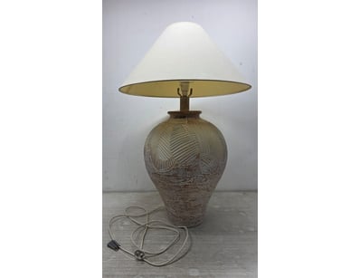 Vintage table lamp featuring a textured ceramic ba...