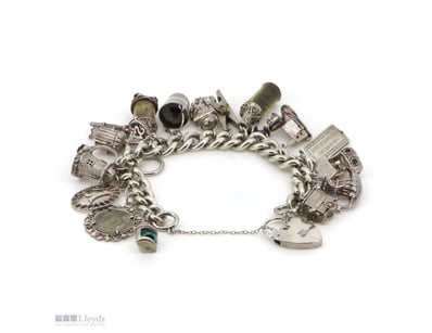 SILVER CHARM BRACELET     

Featuring Multiple Sil...