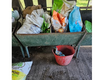 Feeding trough, metal construction, includes feed ...
