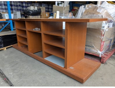 Wooden shelving unit featuring a substantial timbe...