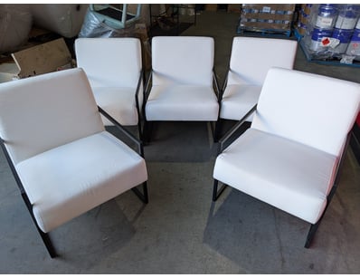 Set of five modern lounge chairs featuring white u...
