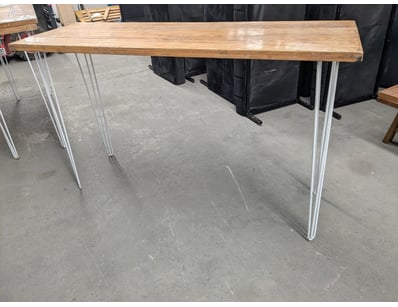 Modern minimalist bar table featuring a natural ti...