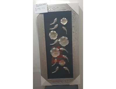 Striking framed artwork featuring a dark navy back...