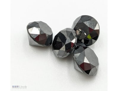 FOUR LOOSE GEMSTONES, COLOUR IS TREATED BLACK

Con...