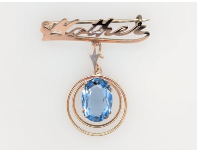 SILVER AND GOLDPLATED GLASS MOTHER BROOCH


583...