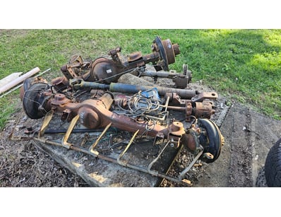 Assorted parts, including drive shaft and axels

S...