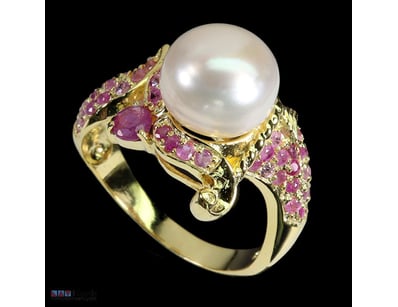 NATURAL PEARL & RUBY RING.      

Natural Pearl & ...