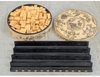 A fine Chinese mahjong set housed in an ornate cyl...