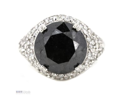 THE CENTRE FEATURES, ONE ROUND FACETED CUT, BLACK ...