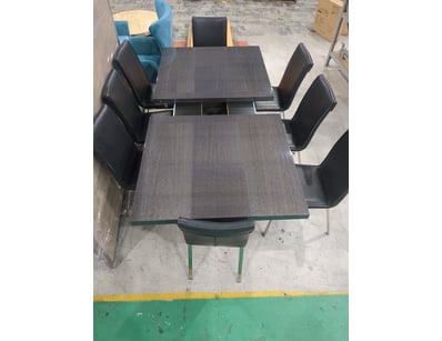 Extending dining table with charcoal grey wood typ...