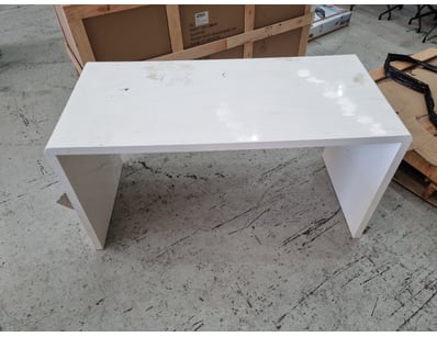 Modern white desk featuring a minimalist design wi...