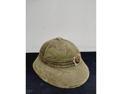 BRITISH COLONIAL PITH HELMET WITH MILITARY BADGE
...