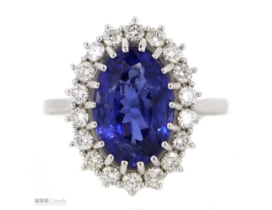 14K WHITE GOLD, TANZANITE AND DIAMOND, HALO RING. ...