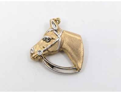 9CT GOLD HORSE HEAD PENDANT

Total Item Weight: ...
