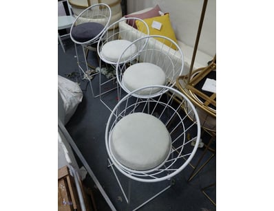Set of modern wire-frame dining chairs featuring w...