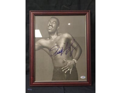 THIS IMAGE FEATURES A FRAMED, AUTOGRAPHED PHOTOGRA...