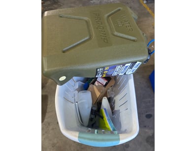 Assorted basket containing water jugg, tie wires, ...