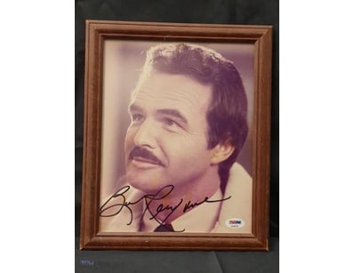 A FRAMED, SIGNED PHOTOGRAPH OF THE ICONIC AMERICAN...